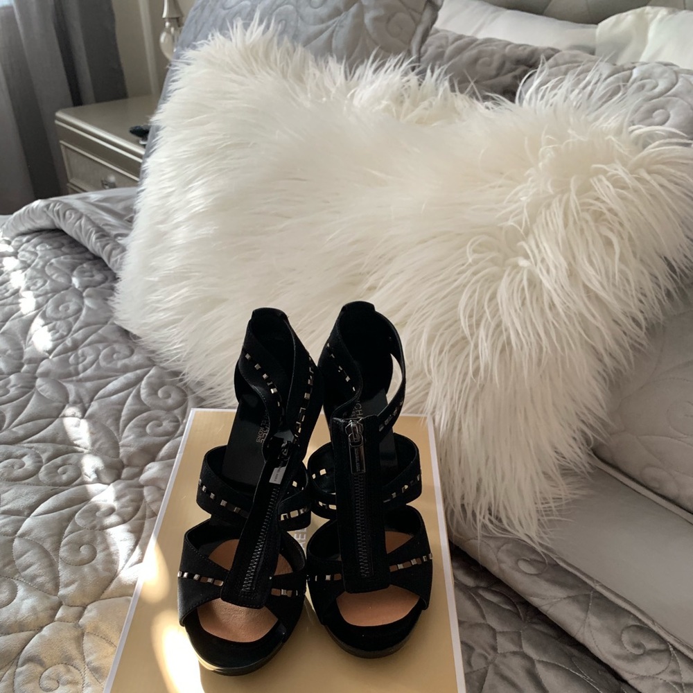 A pair of Michael Kors brand new shoes in box.